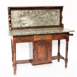 An Edwardian walnut wash stand, with veined grey marble back and top, with cupboard door,