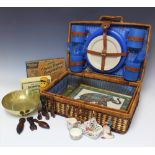 A vintage style picnic set, with two Indian framed painted figures,