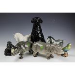 A large Royal Doulton 2341 black Labrador, 33cm high, along with a Melba Ware hippo,