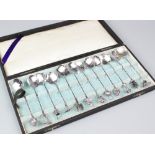 A cased set of twelve Chinese sterling silver teaspoons,