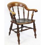 A Victorian ash captain's chair, with leather covered seat, on turned legs,