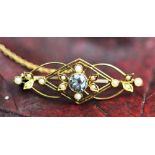 An aquamarine and seed pearl set brooch,