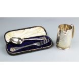 A cased silver christening fork and spoon set, Sheffield 1855, initialled verso,