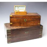 An early 19th century brass mound mahogany campaign writing slope, with recessed brass handles,