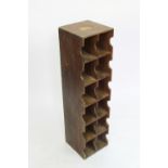 A late 19th century oak bank of twelve shelves, possibly useable as a bottle rack,