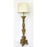 A 19th century gilt wood and gesso altar stick converted to a standard lamp, possibly Italian,