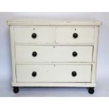 A painted pine chest of three long drawers, on turned feet, 85cm H x 101cm W x 44.