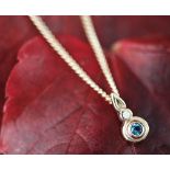 A Clogau rose gold blue zircon and diamond set pendant,