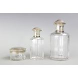 A set of three Art Deco Henri Lapparra Parisian silver mounted dressing table bottles and jars,