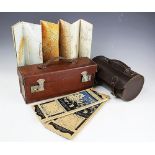 An Army and Navy leather case, enclosing eleven 1930's Ordnance Survey maps of Great Britain,