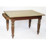 A late Victorian oak dining table, the rectangular top with a moulded edge, with two drawers,