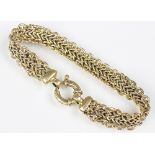 A yellow metal bracelet, the mesh bracelet with large bolt ring clasp, marked indistinctly,