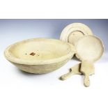 A 19th century turned elm bowl, 41cm diameter, with a carved wood bread board,