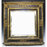 An 18th century gilt pine and gesso wall mirror, probably Italian, with later bevelled plate,