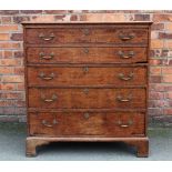 A George III oak secretaire chest, with a fitted drawer over three graduated long drawers,