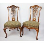 A fine pair of Victorian carved walnut side chairs,