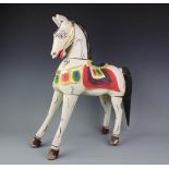 A Vintage Folk Art model horse, painted on pine in polychromes,