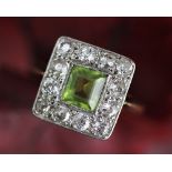 A peridot and diamond cluster ring,