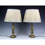 A set of six French gilt metal table lamps,