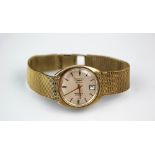 A 9ct Gold Longines Automatic Admiral wristwatch, the silvered dial with gilt batons,