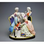 An Italian Bisque conversation group, of four figures dressed in 18th century attire, on oval base,