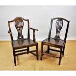 A part set of five George III provincial country oak dining chairs, including one with arms,