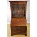 A George III and later oak bureau bookcase,