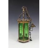 A 19th century style brass hexagonal hall lantern, with green glass panes,