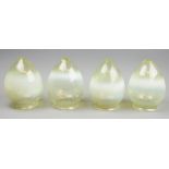 A set of four Arts and Crafts vaseline glass shades, of ovoid form, 15.