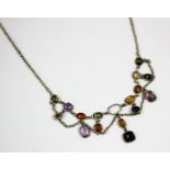 A multi gem set fringe necklace, the native cut stones,