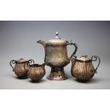 An Indian white metal associated four piece coffee service,