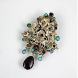 An Indian style garnet and turquoise set decorative brooch,