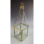 A gilt brass square section hall lanterns, three light with cut glass panes,