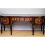 A George III inlaid mahogany bow front side board of large country house proportions,