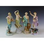 A set of four late 19th century continental porcelain male and female figures emblematic of the