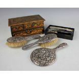 A three piece silver backed dressing table set 'SM & Co', Birmingham 1909,