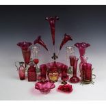 A selection of glass ware and lustres to include a large cranberry glass epergne with three flutes