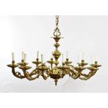 A late 18th century style French gilt brass twelve branch chandelier, of oval form,