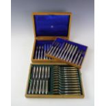 A cased set of twelve silver George V Mappin & Webb dessert knives and forks, Sheffield 1915,