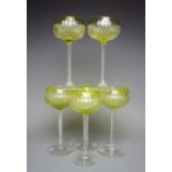 A set of six German cut glass hock glasses, with green glass bowls,