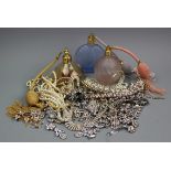 A quantity of assorted paste set jewellery to a tray along with five assorted perfume bottles,