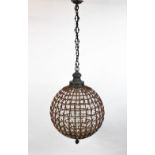 A French moulded glass spherical ceiling light, the openwork frame with bead work detailing,