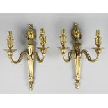 A pair of George III style gilt brass twin branch wall lights,