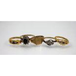 A selection of five gold rings, to include; two diamond and sapphire rings in 18ct yellow gold,