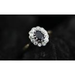 A sapphire and diamond oval cluster ring,