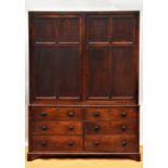 An early 19th century mahogany and pine housekeepers cabinet of large proportions,