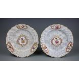 A pair of early 19th century Coalport botanical cabinet plates,