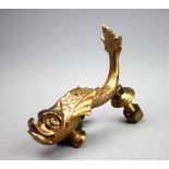 A gilt bronze door knocker and strike, modelled as a dolphin,