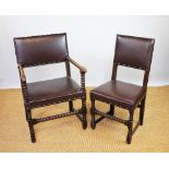 A set of six Carolean style oak dining chairs, including two with arms,