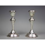 A pair of silver candlesticks, W I Broadway & Co, Birmingham 1967, each with reeded knopped columns,